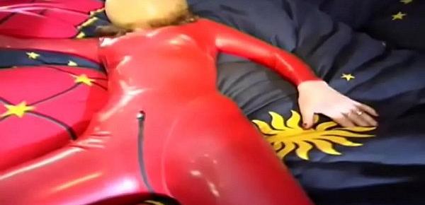  Fetish depravation for a red latex dressed slave